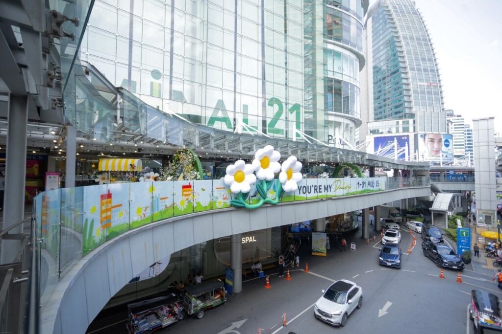 Terminal 21 Bangkok exterior with city traffic in front