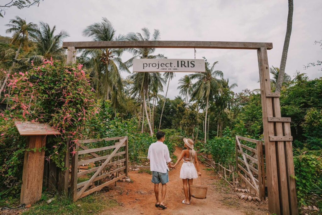 Entrance to Iris Farm at Conrad Koh Samui with lush greenery