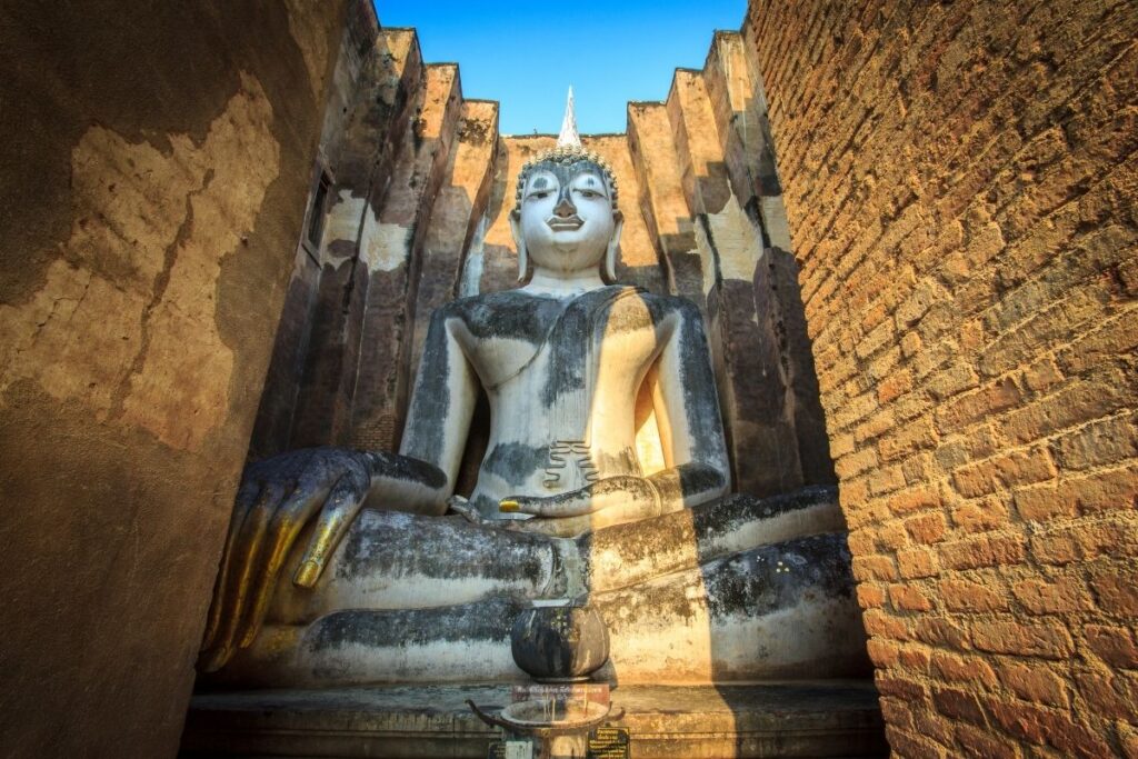 Ancient Buddha statue at Wat Si Chum in Sukhothai Historical Park - A UNESCO World Heritage site in Sukhothai