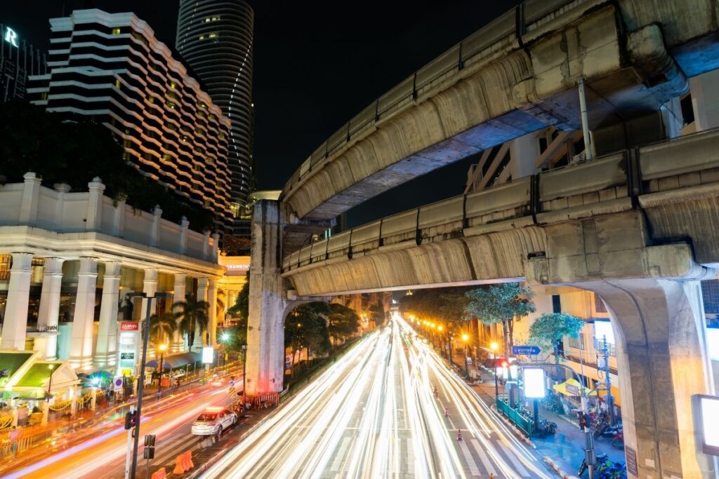 Night view of Ratchaprasong intersection in Bangkok with Skytrain and city lights
